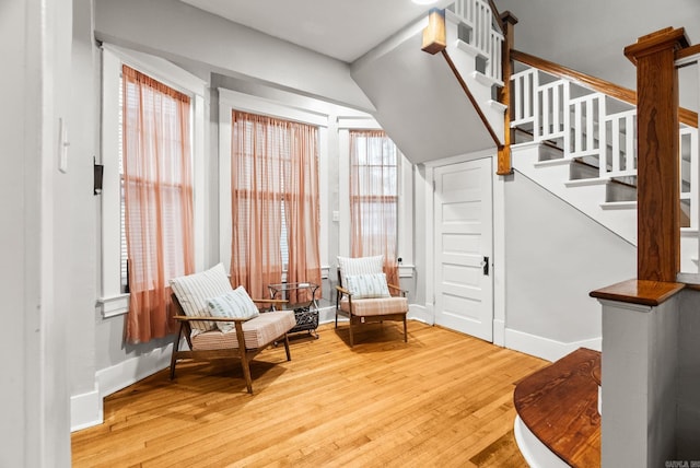 1905 S Battery St, Little Rock, AR 72202 - living area with wood finished floors, baseboards, and stairway