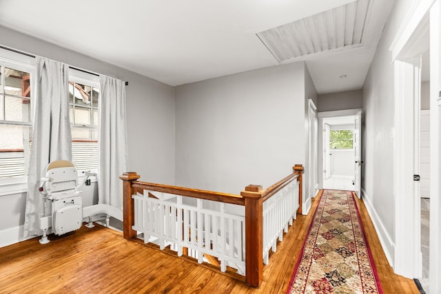 1905 S Battery St, Little Rock, AR 72202 - hallway featuring hardwood / wood-style floors, an upstairs landing, and baseboards