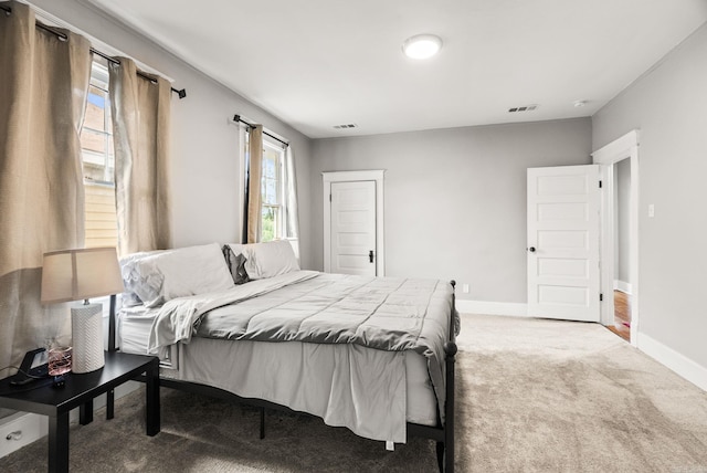 1905 S Battery St, Little Rock, AR 72202 - bedroom featuring carpet floors, multiple windows, and baseboards
