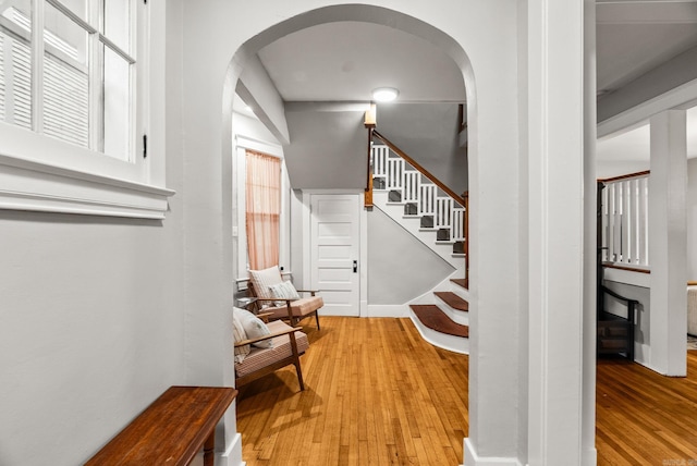 1905 S Battery St, Little Rock, AR 72202 - entrance foyer featuring arched walkways, light wood-style flooring, and stairs