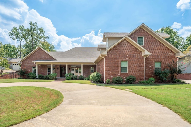 20 Stonegate, Hot Springs, AR 71913 - view of front of house featuring brick siding, a front lawn, curved driveway, a porch, and a shingled roof