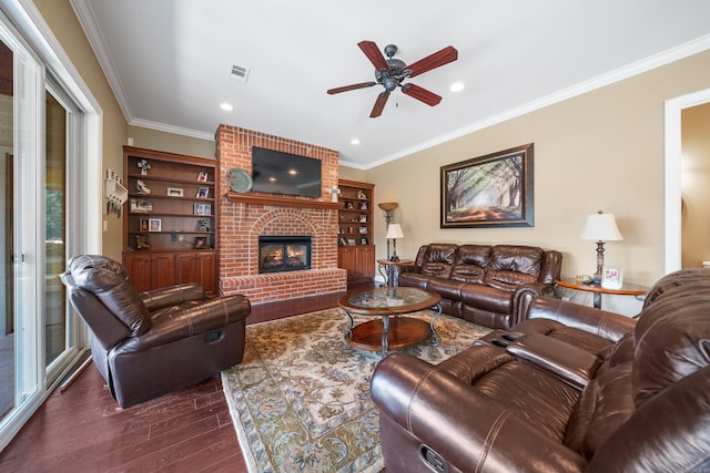 20 Stonegate, Hot Springs, AR 71913 - living area with dark wood-style flooring, a ceiling fan, ornamental molding, a brick fireplace, and recessed lighting