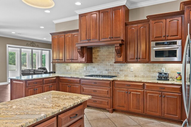 20 Stonegate, Hot Springs, AR 71913 - kitchen featuring light stone counters, tasteful backsplash, crown molding, appliances with stainless steel finishes, and recessed lighting