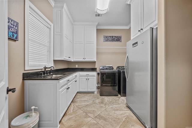 20 Stonegate, Hot Springs, AR 71913 - clothes washing area featuring washer and dryer, cabinet space, and crown molding