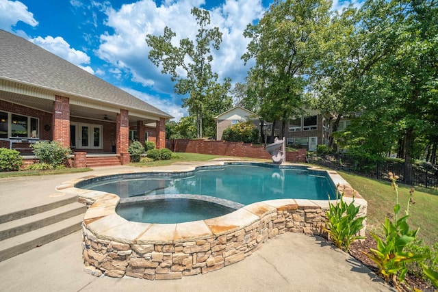 20 Stonegate, Hot Springs, AR 71913 - view of pool with a water slide, french doors, fence, a pool with connected hot tub, and a patio area