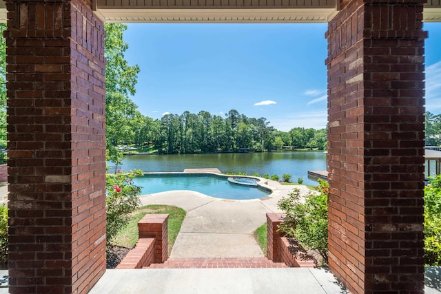 20 Stonegate, Hot Springs, AR 71913 - view of pool with a pool with connected hot tub and a water view