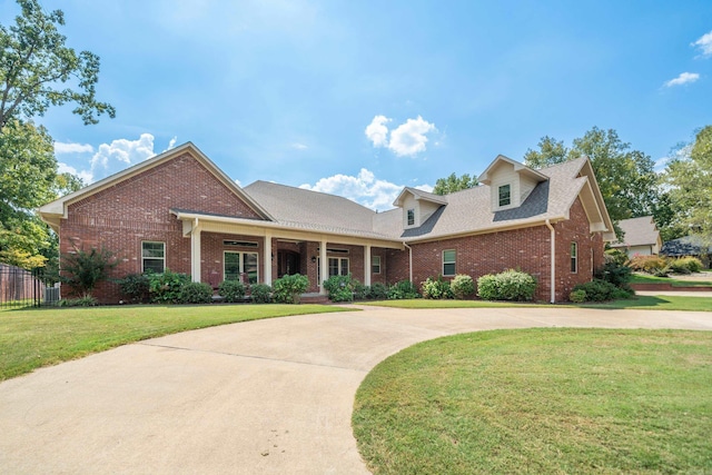20 Stonegate, Hot Springs, AR 71913 - view of front of house with brick siding, curved driveway, a porch, and roof with shingles