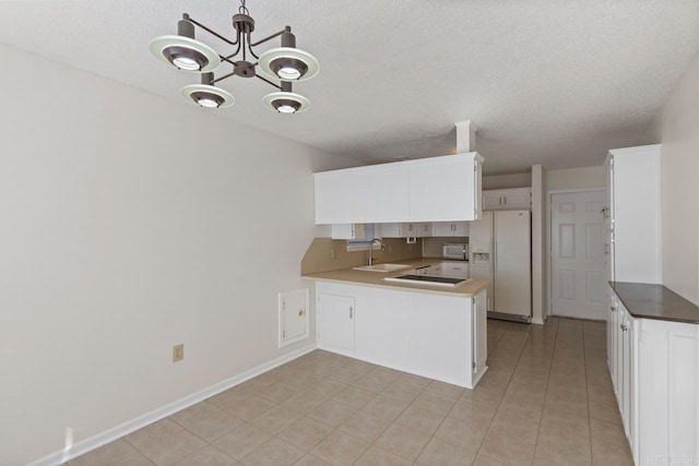 51 Fieldcrest Cir, Cabot, AR 72086 - kitchen featuring white appliances, a sink, a peninsula, a chandelier, and white cabinetry