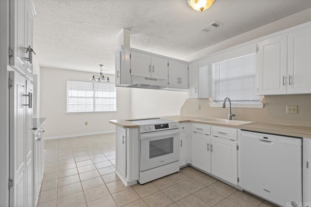 51 Fieldcrest Cir, Cabot, AR 72086 - kitchen featuring white appliances, a sink, light countertops, under cabinet range hood, and light tile patterned floors