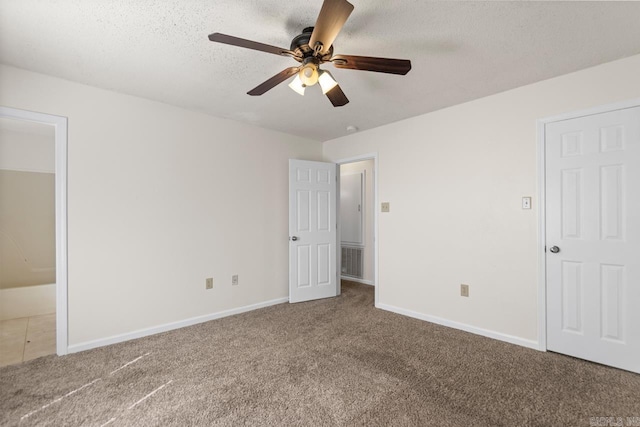 51 Fieldcrest Cir, Cabot, AR 72086 - unfurnished bedroom with carpet, baseboards, a textured ceiling, and ceiling fan