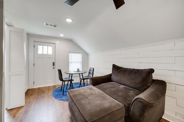 living area with hardwood / wood-style flooring and lofted ceiling