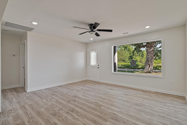 spare room featuring light wood-style floors, ceiling fan, baseboards, and recessed lighting