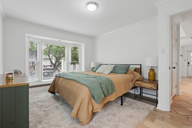 4911 B St, Little Rock, AR 72205 - bedroom with ornamental molding and light wood-style flooring