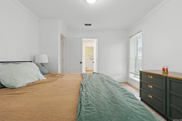 4911 B St, Little Rock, AR 72205 - bedroom featuring ornamental molding, light wood-style flooring, and baseboards