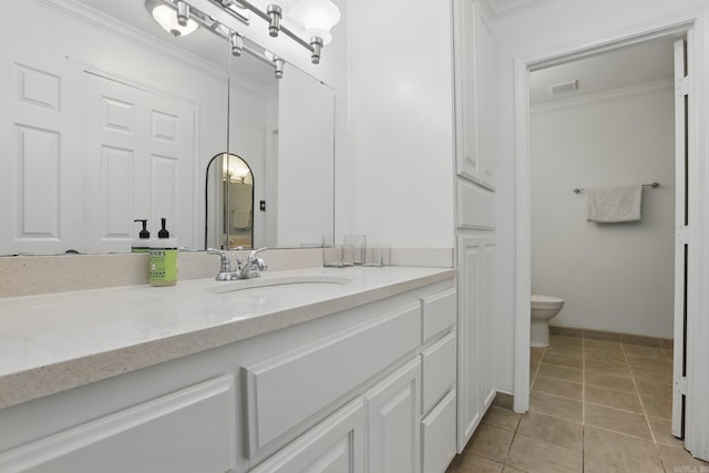 4911 B St, Little Rock, AR 72205 - bathroom with crown molding, vanity, toilet, and tile patterned flooring