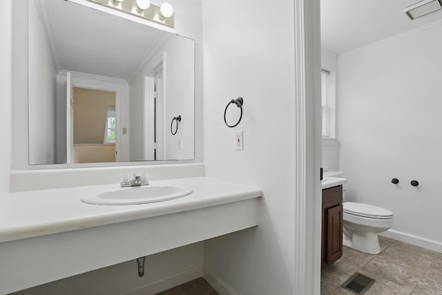 4911 B St, Little Rock, AR 72205 - bathroom with ornamental molding, vanity, toilet, and baseboards
