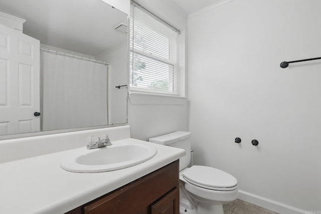 4911 B St, Little Rock, AR 72205 - bathroom featuring vanity, toilet, ornamental molding, tile patterned flooring, and baseboards