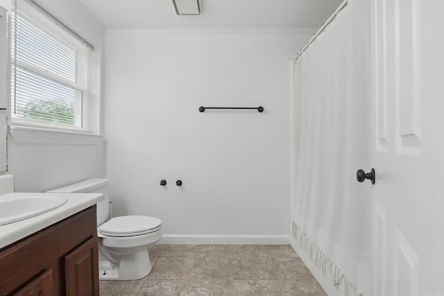 4911 B St, Little Rock, AR 72205 - bathroom featuring vanity, toilet, ornamental molding, and baseboards