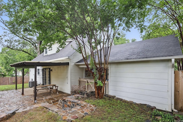 4911 B St, Little Rock, AR 72205 - rear view of house featuring a patio area, fence, and roof with shingles