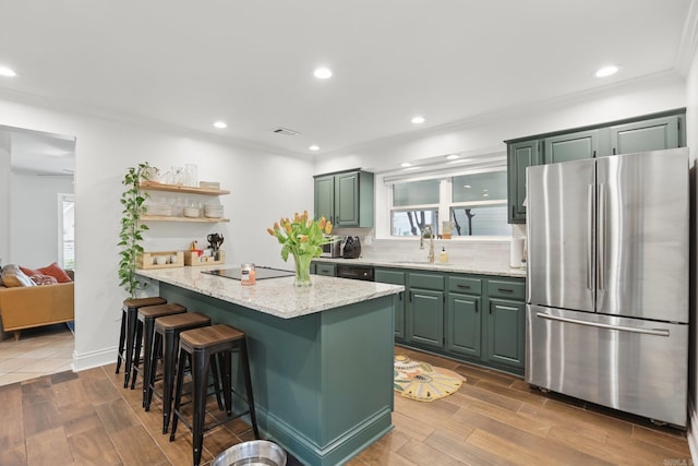 4911 B St, Little Rock, AR 72205 - kitchen featuring black appliances, green cabinetry, open shelves, wood finished floors, and recessed lighting