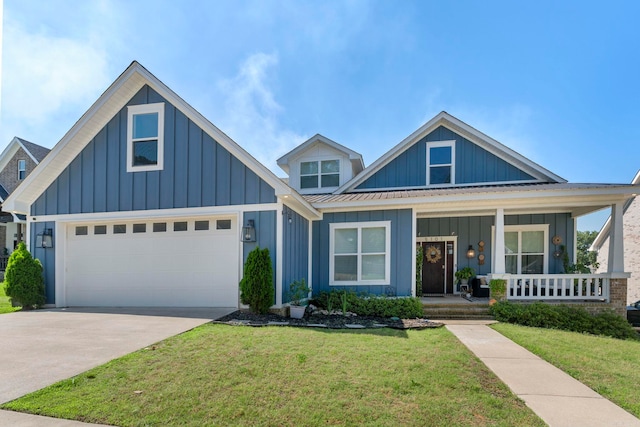 5101 Peace Ln, Alexander, AR 72002 - view of front of house featuring board and batten siding, covered porch, a front yard, and concrete driveway