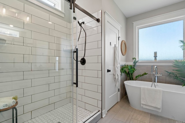 5101 Peace Ln, Alexander, AR 72002 - bathroom featuring a stall shower and a freestanding bath