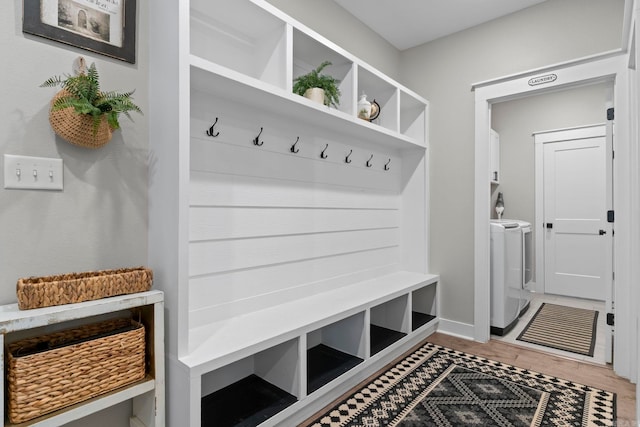 5101 Peace Ln, Alexander, AR 72002 - mudroom featuring washing machine and clothes dryer, light wood-type flooring, and baseboards