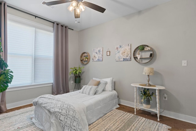 5101 Peace Ln, Alexander, AR 72002 - bedroom featuring baseboards, wood finished floors, and ceiling fan