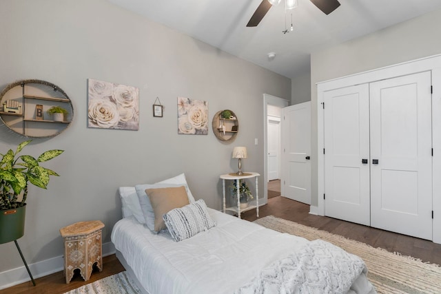 5101 Peace Ln, Alexander, AR 72002 - bedroom with wood finished floors, a closet, baseboards, and ceiling fan