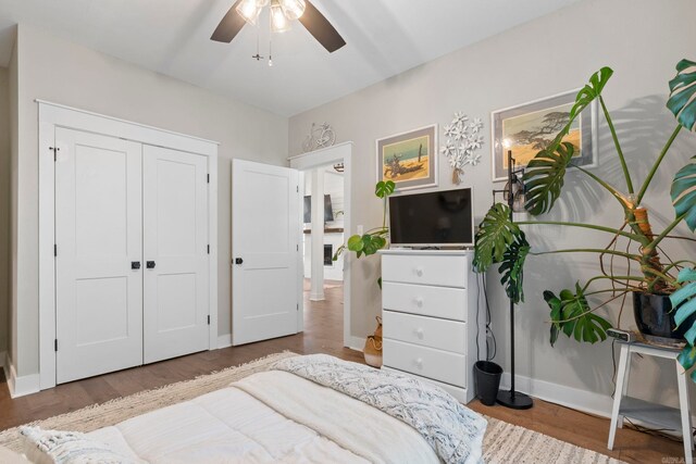 5101 Peace Ln, Alexander, AR 72002 - bedroom with baseboards, a closet, a ceiling fan, and wood finished floors