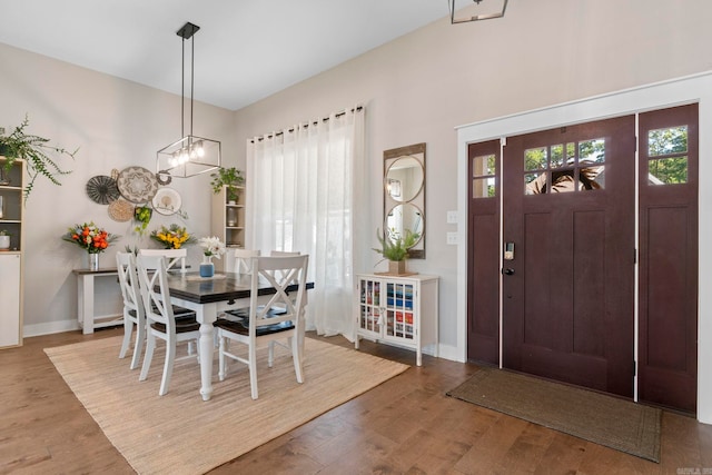 5101 Peace Ln, Alexander, AR 72002 - dining room featuring plenty of natural light, wood finished floors, baseboards, and a chandelier