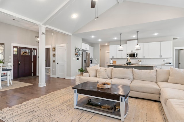 5101 Peace Ln, Alexander, AR 72002 - living room featuring light wood-style floors, recessed lighting, a ceiling fan, high vaulted ceiling, and baseboards