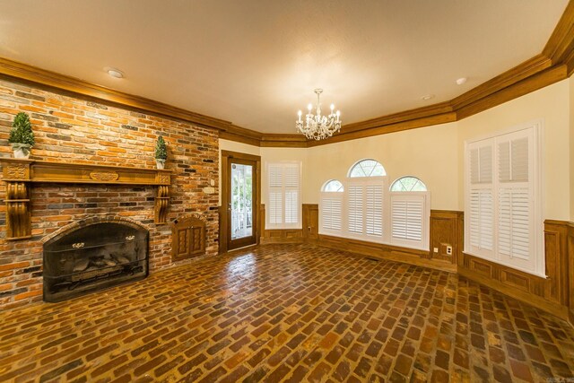 5401 N Hills Blvd, North Little Rock, AR 72116 - unfurnished living room with brick flooring, a chandelier, wainscoting, crown molding, and a brick fireplace