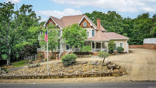 5401 N Hills Blvd, North Little Rock, AR 72116 - view of front of house featuring a porch, a chimney, and a tile roof
