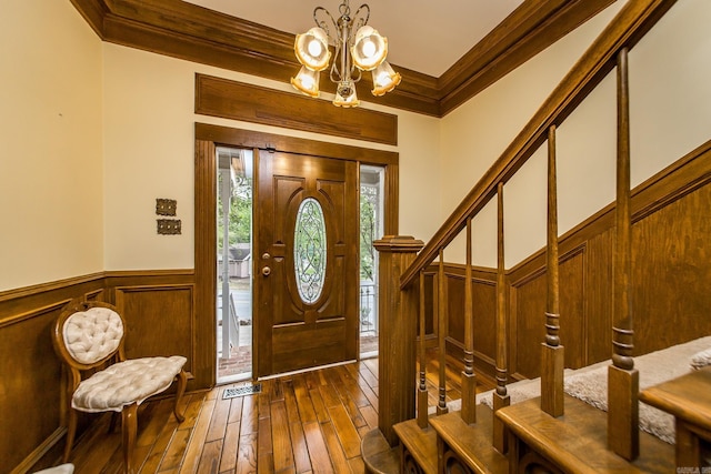 5401 N Hills Blvd, North Little Rock, AR 72116 - entryway with ornamental molding, dark wood finished floors, a chandelier, wainscoting, and stairs