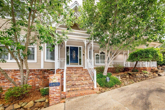 5401 N Hills Blvd, North Little Rock, AR 72116 - view of front facade featuring covered porch and brick siding