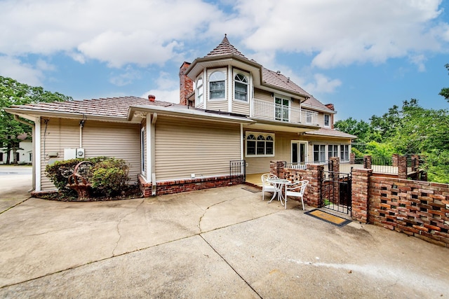 5401 N Hills Blvd, North Little Rock, AR 72116 - rear view of property with a patio, a gate, and fence