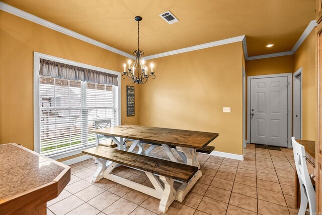 121 Lily Dr, Maumelle, AR 72113 - dining room with ornamental molding, a chandelier, baseboards, and light tile patterned floors