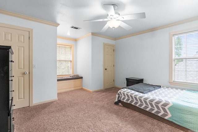 121 Lily Dr, Maumelle, AR 72113 - bedroom featuring carpet floors, multiple windows, baseboards, crown molding, and ceiling fan
