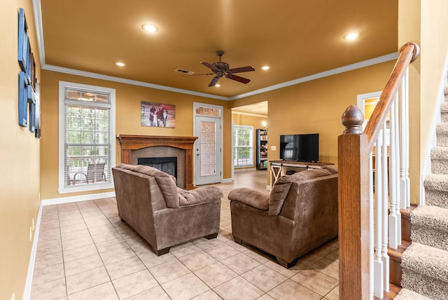 121 Lily Dr, Maumelle, AR 72113 - living area with stairs, light tile patterned flooring, recessed lighting, crown molding, and baseboards