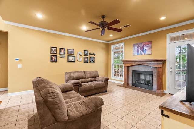 121 Lily Dr, Maumelle, AR 72113 - living room featuring ornamental molding, a ceiling fan, light tile patterned floors, a high end fireplace, and recessed lighting
