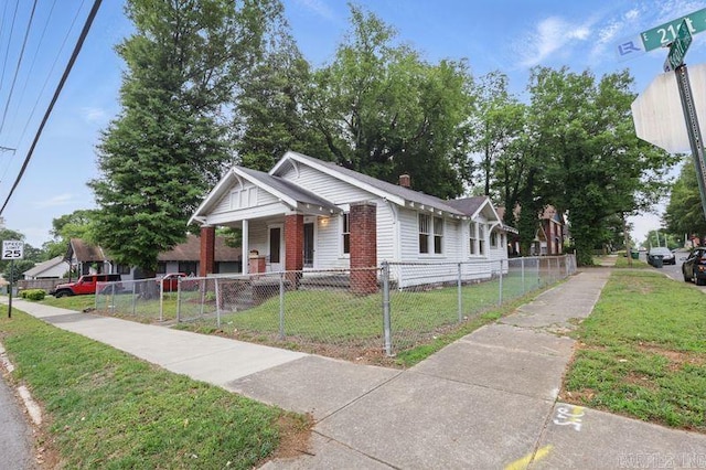 201 E 21st St, Little Rock, AR 72206 - bungalow-style home with a porch and brick siding