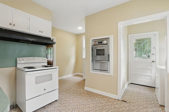 201 E 21st St, Little Rock, AR 72206 - kitchen with white range with electric cooktop, oven, under cabinet range hood, white cabinets, and a warming drawer