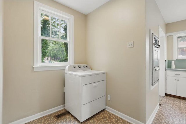 201 E 21st St, Little Rock, AR 72206 - laundry area with washer / clothes dryer, baseboards, and light floors