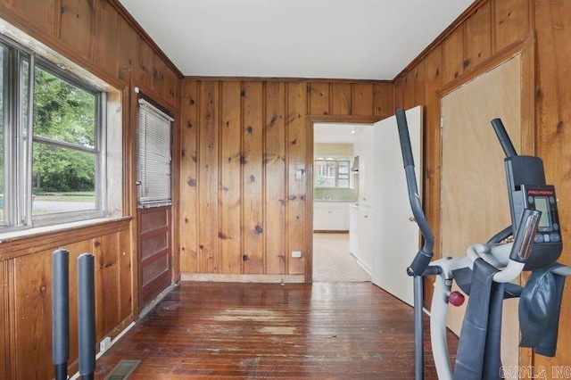201 E 21st St, Little Rock, AR 72206 - entryway with wooden walls and dark wood-style flooring