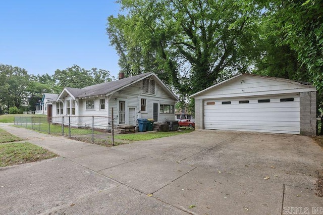201 E 21st St, Little Rock, AR 72206 - view of front of house with a garage, an outdoor structure, and a chimney
