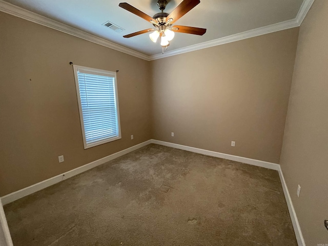 unfurnished room with crown molding, a ceiling fan, baseboards, and carpet flooring