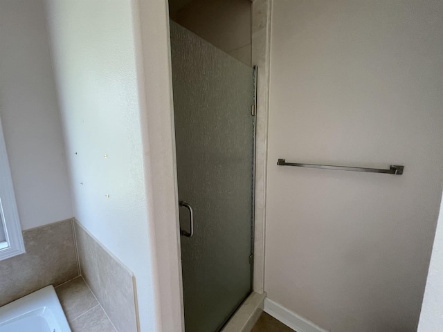 full bathroom featuring a stall shower