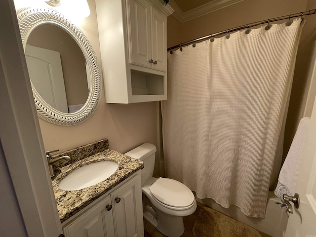 bathroom featuring ornamental molding, toilet, and vanity