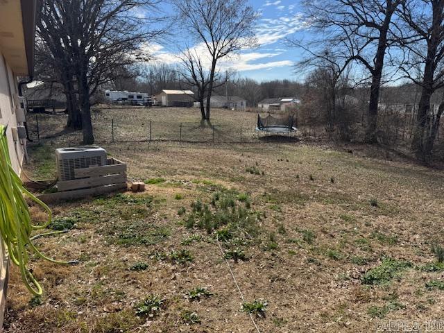 21 Emma Dr, Pocahontas, AR 72455 - view of yard with central air condition unit and fence